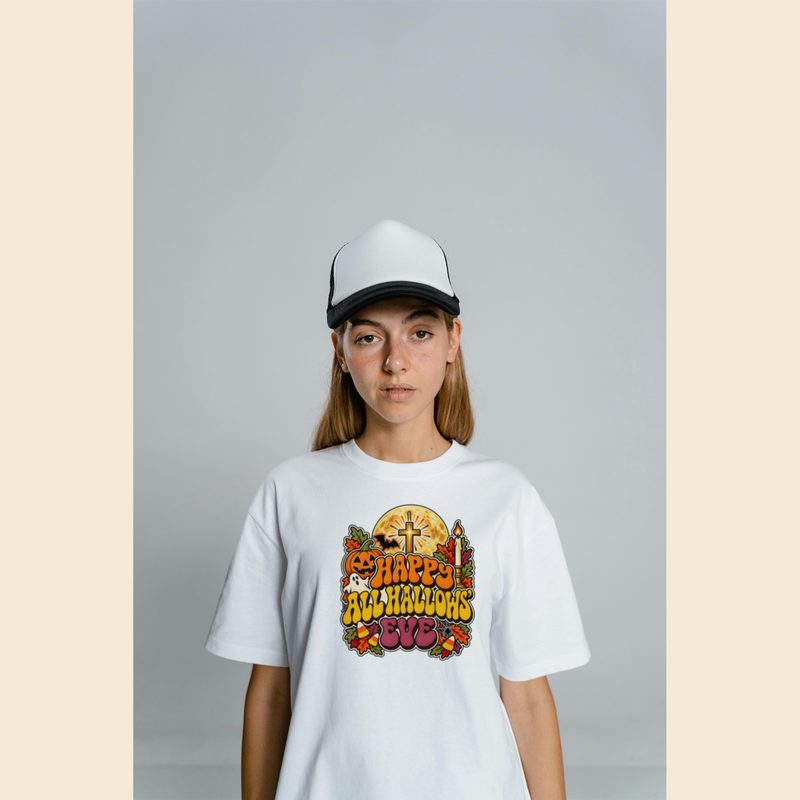 Model wearing the Kids Catholic Halloween Shirt with happy All Hallows Eve Retro Groovy Youth Tee