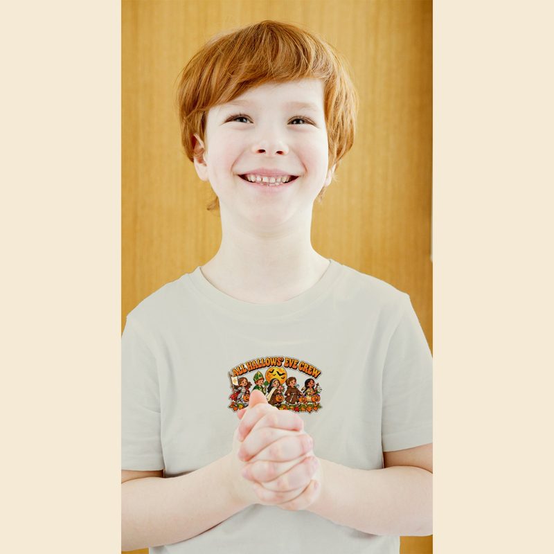 Model wearing the Toddler All Hallows Eve Crew Tee with little Saints Trick or Treat